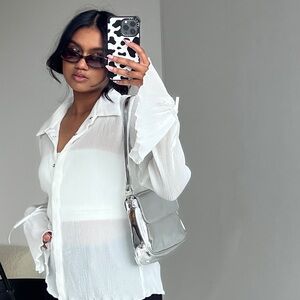 White long sleeve pleated blouse with ties